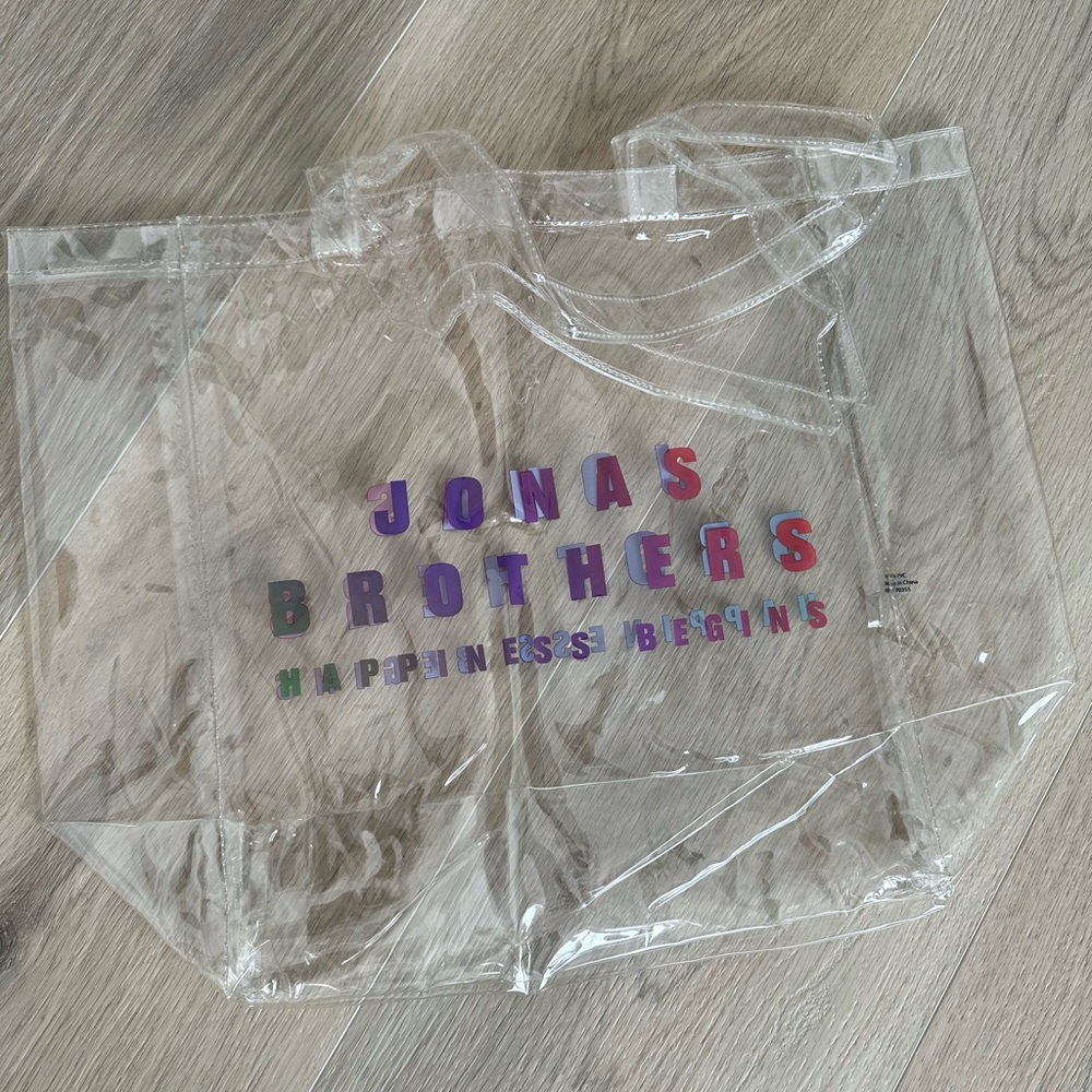Jonas Brothers Happiness Begins Clear Tote Bag with Colorful Text